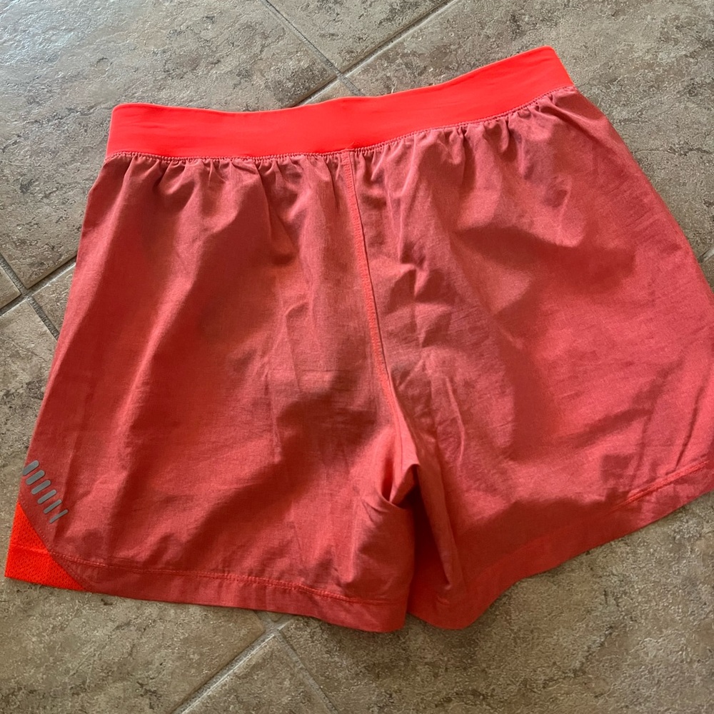 Under Armour Fitted Orange running shorts. Size medium.